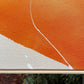 close up photo of original painting by britchida showing orange and white shapes