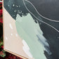 close up of corner of original canvas painting ONE THING AT A TIME by britchida showing light teal, navy, and white paint shapes.