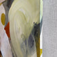 close up photo of original abstract painting by britchida with yellow, gray, orange, and white shapes on canvas