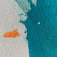 close up photo of original abstract painting by britchida with teal, orange, green, and white shapes on canvas