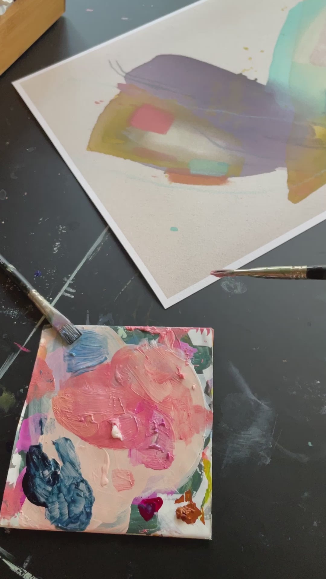 video of print of abstract painting by britchida with yellow, teal, peach, navy, and lilac shapes with various thin lines with paint palette in lower left corner