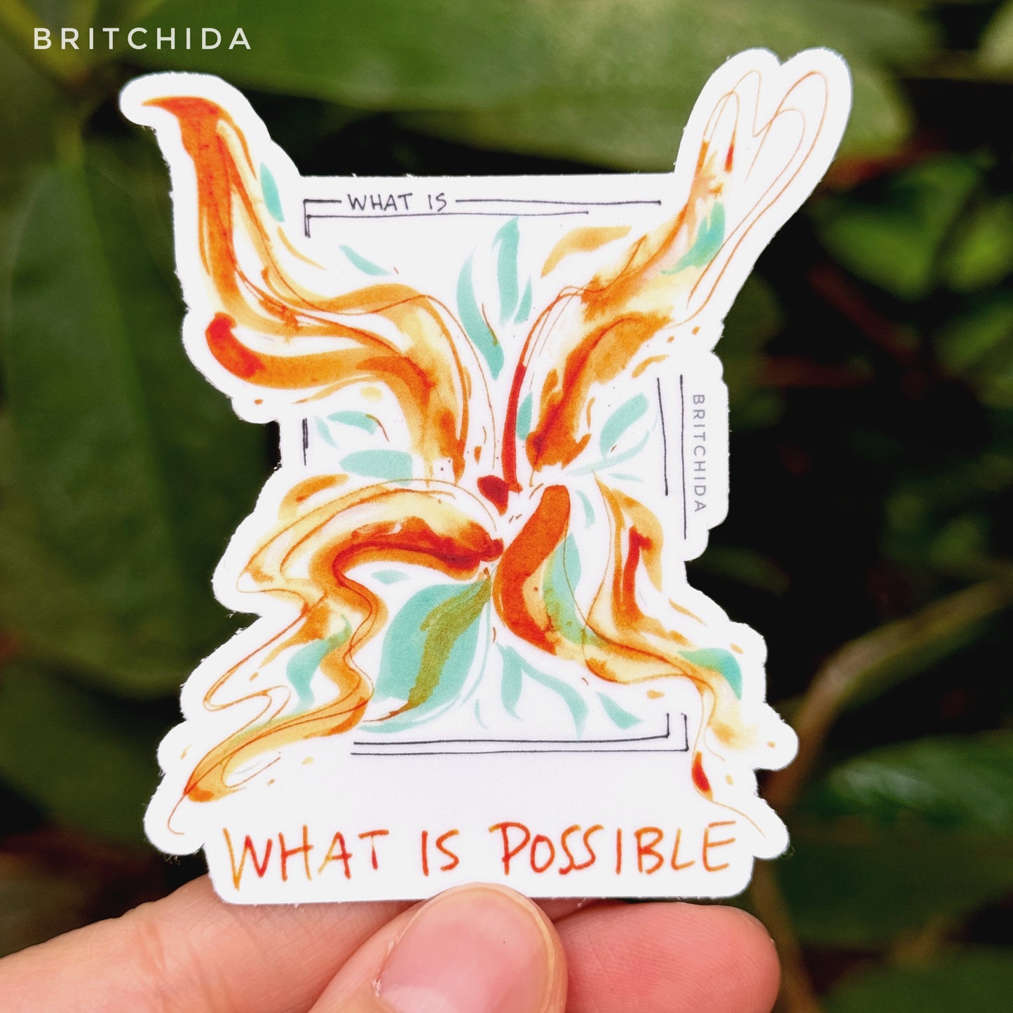 sticker of What is Possible print with a black box labeled "what is" and bright orange, yellow, and teal paint strokes emerging from the center of the box outside the lines and the text "what is possible"