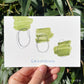  Three shapes that descend from the top left toward the green paint mostly above it. The middle one has green part way in, the last one is filled with green. Titled "grounding" 