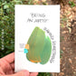 “Being an artist” is written over a large green and yellow swoop labeled “making something” with tiny marks labeled “having a good idea” and “skill”