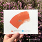large orange brush stroke labeled “uncertainty” with a small blue horizontal line in the middle with a stick figure sitting on it. The blue is labeled ‘self trust.’