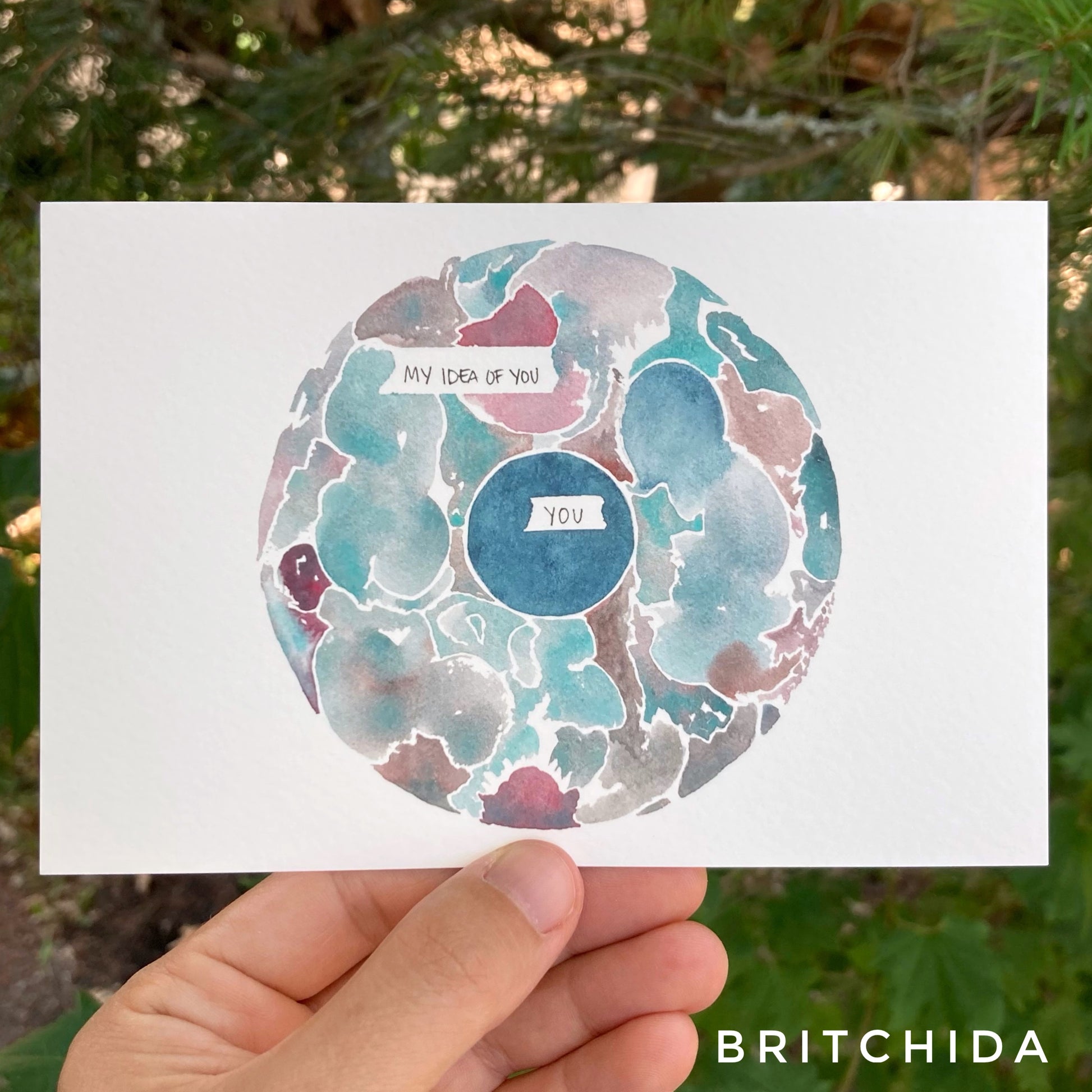 a small solid circle labeled “you” surrounded with a broad ring of complex watercolor patterns of varying colors labeled “my idea of you.”